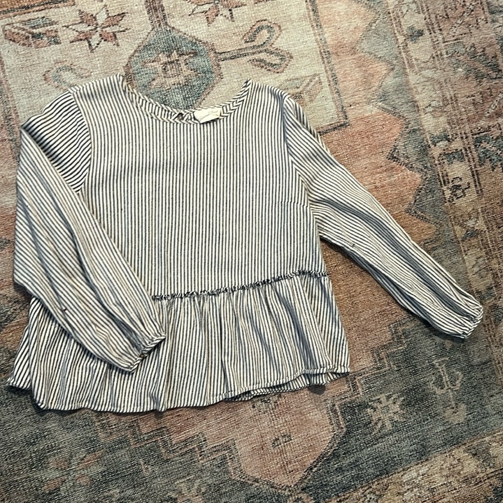 Pinstripe float blouse with cinched cuffs.
